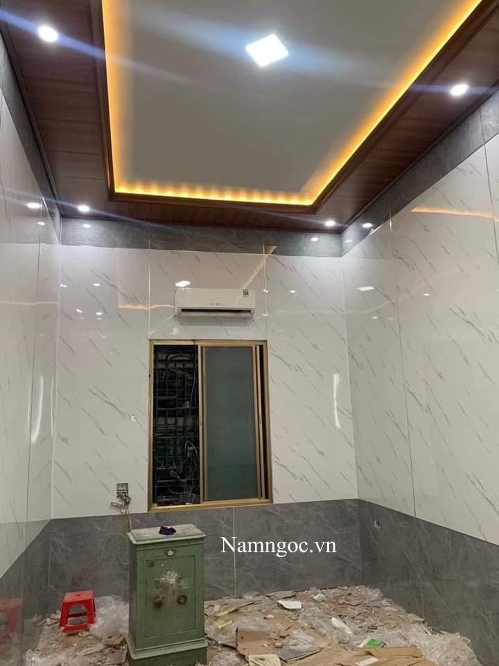 Mẫu phòng khách ốp nhựa PVC giả đá đẹp